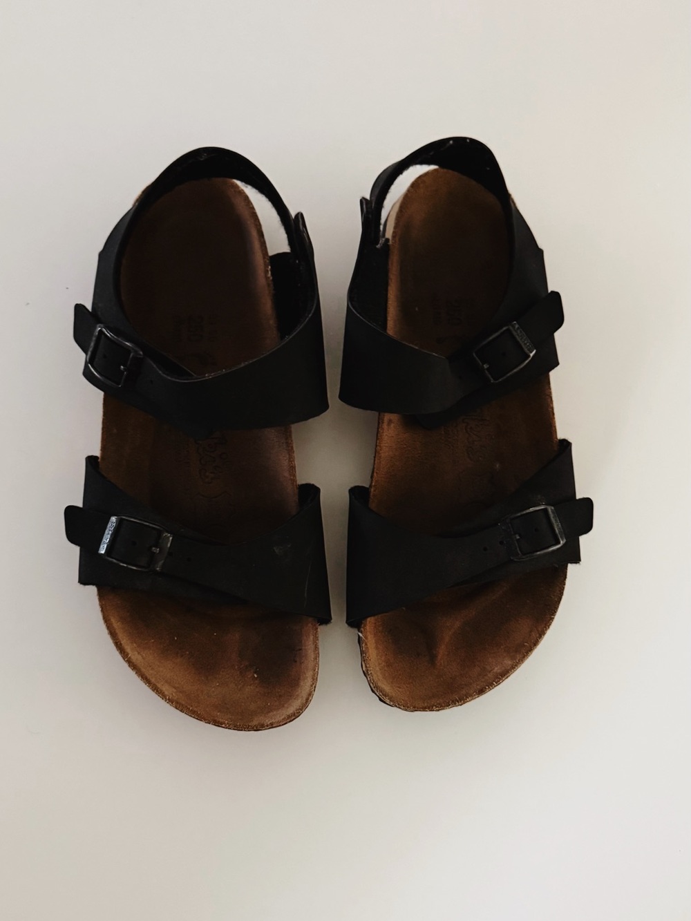 Birkenstock Birki’s Black Women’s Two-Strap Sandals with Brown Footbed